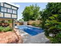 Inviting backyard showcasing a rectangular pool, patio, and privacy fence at 10520 W 101St Pl, Westminster, CO 80021