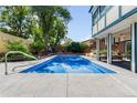Backyard view of rectangular pool area with spacious patio area at 10520 W 101St Pl, Westminster, CO 80021
