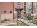 Exterior entrance to condo building with red brick, an awning and easy access to all units at 14321 E Tennessee Ave # 1-307, Aurora, CO 80012