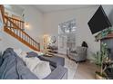 Inviting living room featuring natural light, comfortable seating, and a cozy fireplace at 1080 E 130Th Ave # A, Thornton, CO 80241