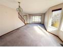 Spacious living room with large windows and neutral carpeting at 1524 E Weldona Way, Superior, CO 80027