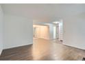 The spacious living room showcases the open floor plan and wood-look floors at 5300 E Cherry Creek South Dr # 217, Denver, CO 80246