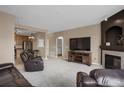 Spacious living room adjacent to kitchen offers open floor plan at 3601 E 103Rd Cir # B11, Thornton, CO 80229