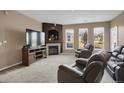 Inviting living room with a cozy fireplace and comfortable seating at 3601 E 103Rd Cir # B11, Thornton, CO 80229