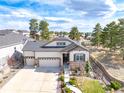 Well-maintained home with a three-car garage, stone accents, and inviting curb appeal at 23742 E Calhoun Ave, Aurora, CO 80016