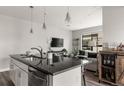 Inviting living room with a large window, comfortable seating, and stylish decor at 1990 S Holly St # 3, Denver, CO 80222
