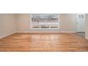 Bright living room features hardwood floors, and large window, providing lots of natural light at 2455 E Yale Ave, Denver, CO 80210