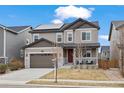 Inviting two-story home showcasing modern architecture, neutral tones, and well-maintained landscaping at 6220 Waterman Way, Frederick, CO 80516