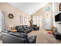 Bright and airy living room with vaulted ceiling, natural light, and comfortable seating arrangement at 2782 S Ceylon St, Aurora, CO 80013