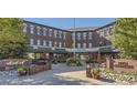 The Parker Station building with a brick facade, attractive landscaping, and convenient parking at 11030 Snowdon St, Parker, CO 80134