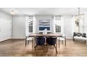 Well-lit dining room with hardwood floors and modern decor at 1027 Koss St, Erie, CO 80516