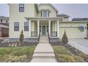 Front entrance with stairs leading to a covered porch at 1885 Hickory Ave, Erie, CO 80516