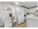 Bright kitchen with modern appliances, eat-in area, and stylish decor at 1315 Estes St # 13C, Denver, CO 80215