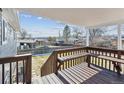 Wooden deck overlooking a backyard with a view of the neighborhood at 9525 Damon Dr, Northglenn, CO 80260