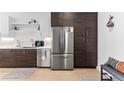Modern kitchen featuring stainless appliances, white cabinets, and hard wood floors, perfect for cooking and entertaining at 2550 Lawrence St # Rb308, Denver, CO 80205