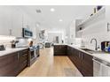 Modern kitchen with stainless steel appliances and white cabinets at 2550 Lawrence St # Rb308, Denver, CO 80205