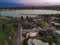 Stunning aerial view of the neighborhood, showcasing the lake, city skyline, and modern homes at 2501 Vrain St, Denver, CO 80212