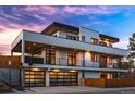 Striking modern home featuring balconies, multiple garage doors, and a sleek design at 2501 Vrain St, Denver, CO 80212