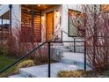 Inviting front entrance with modern design, featuring well-lit steps and lush landscaping at 2501 Vrain St, Denver, CO 80212