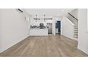 Open concept kitchen with white cabinets and stainless steel appliances at 3955 W 13Th Ave, Denver, CO 80204