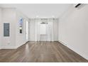 Spacious living area featuring hardwood floors and large windows at 3955 W 13Th Ave, Denver, CO 80204