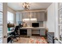 Functional home office featuring built-in storage, a desk, and great lighting for a productive workspace at 8204 S Vandriver Way, Aurora, CO 80016