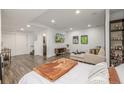 Cozy basement with stylish decor, entertainment setup, and finished flooring at 1754 W 66Th Ave, Denver, CO 80221