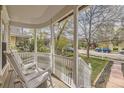 Charming front porch featuring white rocking chairs and classic railing, perfect for relaxing outdoors at 826 Maxwell Ave, Boulder, CO 80304