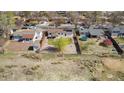 Aerial view of a backyard featuring a covered patio and a trampoline at 14823 E Colgate Dr, Aurora, CO 80014