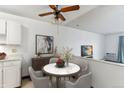 Cozy dining area featuring a modern marble-top table, comfortable seating, and stylish decor at 635 S Alton Way # 12C, Denver, CO 80247