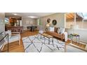 Bright living room featuring hardwood floors, contemporary furnishings, and lots of natural light at 1646 S Stuart St, Denver, CO 80219