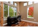 Bright office space with large windows and beautiful hardwood floors at 14022 E Fair Pl, Centennial, CO 80111