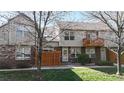 Charming townhome with a well-maintained front yard, brick accents, and a cozy fenced-in patio area at 1381 W 112Th Ave # B, Westminster, CO 80234