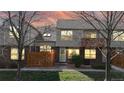 Charming townhome featuring well-maintained front yard, brick accents, and a cozy fenced-in patio area at 1381 W 112Th Ave # B, Westminster, CO 80234