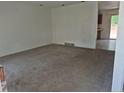 Cozy living room featuring neutral carpet and an open layout to the kitchen at 18249 E Mexico Pl, Aurora, CO 80017