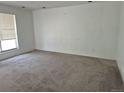Bright living room with neutral carpet and large window bringing in natural light at 18249 E Mexico Pl, Aurora, CO 80017