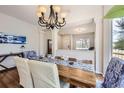 Cozy dining room with natural light and chandelier at 3744 Gypsum Ct, Superior, CO 80027