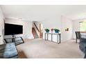 Spacious living room with neutral carpet, perfect for entertaining or relaxing at home at 7350 Devinney Ct, Arvada, CO 80005