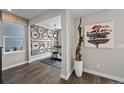 Modern living space with hardwood flooring, and a unique bicycle wheel wall decoration at 1793 W 166Th Ave, Broomfield, CO 80023