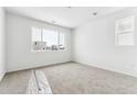 Bright bedroom with carpeted floor and large window at 4527 Boone Cir, Brighton, CO 80601