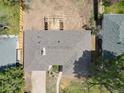 Bird's-eye view of the house highlighting the roof, landscaping, and the building under construction at the back at 404 S Oneida Way, Denver, CO 80224
