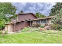 Home with a lawn on a cloudy day at 2621 S Kingston Ct, Aurora, CO 80014