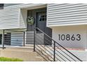 Close-up of front entrance, highlighting the wreath and house number at 10863 W 67Th Pl, Arvada, CO 80004