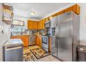Well-equipped kitchen features stainless steel appliances, including a modern dishwasher at 2279 Coronado Pkwy # B, Denver, CO 80229