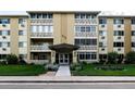 Exterior shot showing the building with well-maintained landscaping at 695 S Alton Way # 5A, Denver, CO 80247