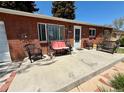 Comfortable seating on the front porch, perfect for enjoying the outdoors at 2213 S Meade Street, Denver, CO 80219