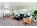 Bright and airy living room featuring stylish decor, comfortable seating, and an inviting atmosphere at 9811 W 105Th Ave, Westminster, CO 80021