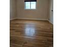 Spacious bedroom with beautiful hardwood floors, offering a bright and airy feel at 1390 Ash Ct, Thornton, CO 80229