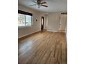 Inviting living room with gleaming hardwood floors, ample natural light, and a welcoming atmosphere at 1390 Ash Ct, Thornton, CO 80229