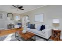 Light-filled living room with a fireplace and comfortable seating at 1445 Elm St, Denver, CO 80220